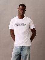 a man in a CKJ Lasso Graphic Crewneck T-Shirt